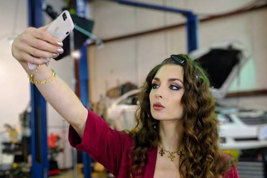 Vain Woman Selfie A woman taking a selfie