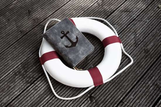 Crown Royalty A Bible resting in a life preserver