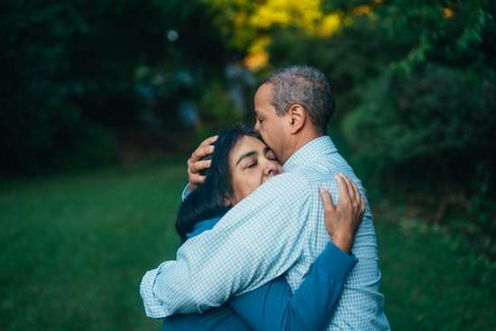 Couple Hugging with Selfless Love An older couple wraps their arms around each other in a loving embrace.