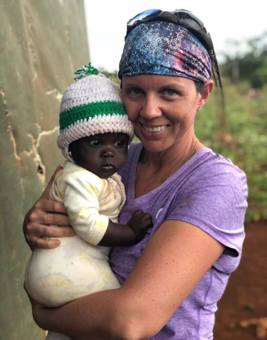 Missionary Carrying Baby A medical missionary holding a baby she helped