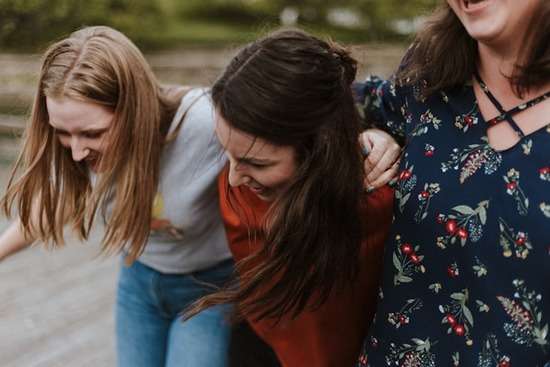 A Faith Group of Three Women Having Fun Three young women together, resembling the benefits of joining a faith community