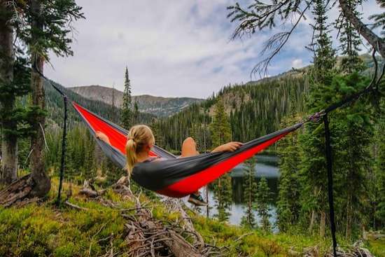Woman in Hammock Resting on Sabbath A woman relaxing in a hammock, taking in nature