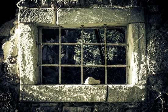 Old Prison Window A dark, stony prison cell with a barred window helps us imagine where John ended up after his arrest.