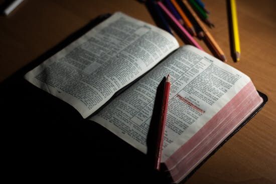 Open Bible with Highlight of Psalm 23:1 An open Bible surrounded by colored pencils for taking Bible study notes.