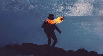 Person with torch Person with a torch in dark night as we learn how God used Gideon of Manasseh to deliver Israelites from Midianite oppression