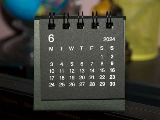 Calendar with Saturday and Sunday at the end of the week A spiral-bound calendar showing both Saturday and Sunday