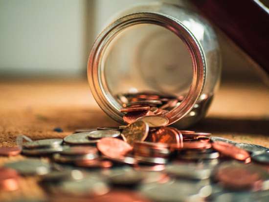 Coins in a Jar A jar with coins spilling out