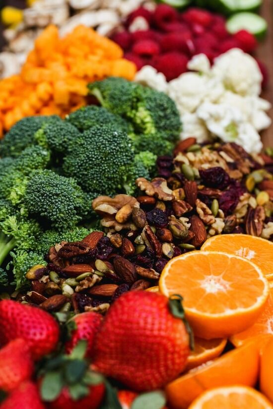 An assortment of fruits, vegetables, nuts, and seeds—the components of a healthful diet as taught by Ellen White
