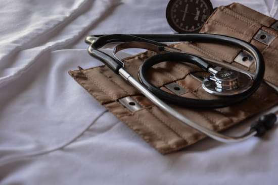A brown stethoscope and a blood pressure cuff, symbolizing the health journey of Ellen White