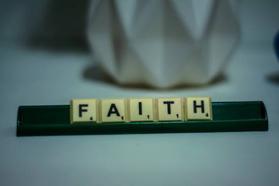Scrabble letters that spell the word faith Scrabble letters spelling out the word 'faith'