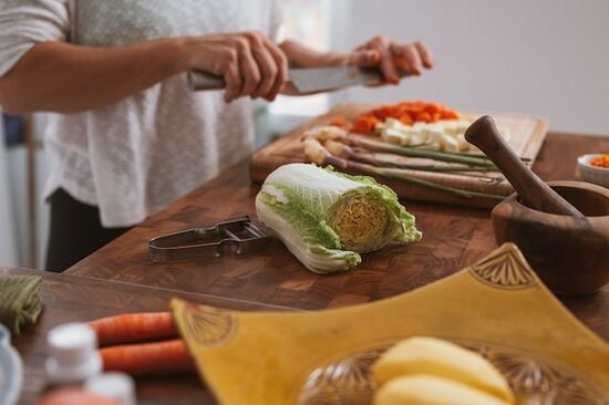 Chopping Vegetables A woman chops vegetables for a meal after deciding to give up meat eating