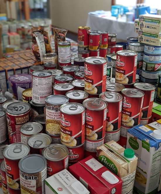 Canned Food Stockpile A stack of canned soup and other grocery items bought in preparation for the End Times.