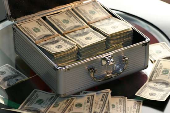 Money in a Metal Briefcase A briefcase full of money.