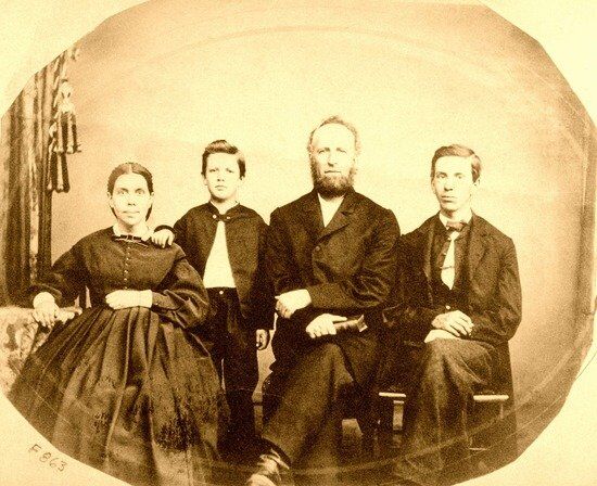 A family portrait of Ellen White with her husband and two sons