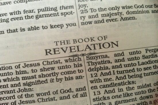 The Book of revelation A close up shot of the title "The Book of Revelation" in the Bible.