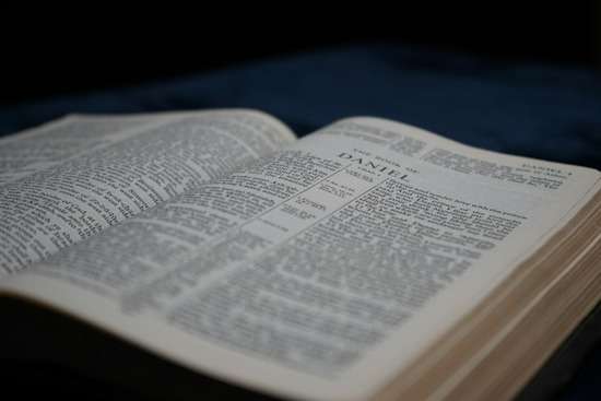 A Bible Open to the Book of Daniel An open Bible turned to the book of Daniel.