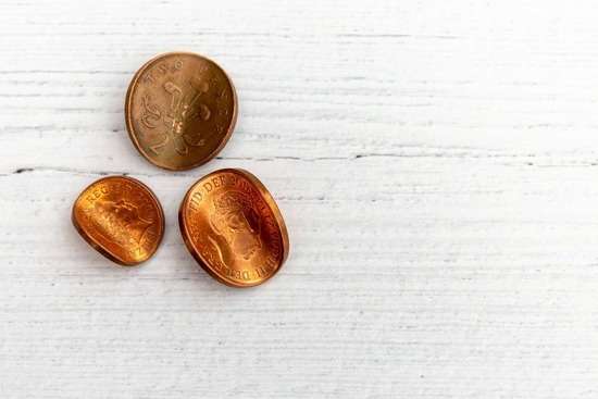 Three slightly bent copper coins represent the negative view Pharisees and Sadducees had of tax collectors.