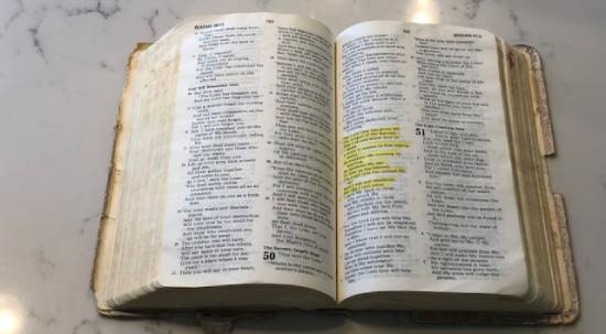 A Bible opened to the book of Isaiah.