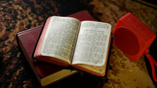 Bible Open to the Book of Revelation A Bible lying open to the Book of Revelation, which has puzzled many about how the world will end.