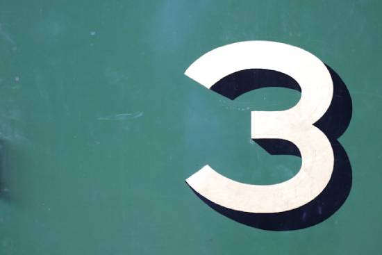 he number 3 in white with a blue shadow on a green background, signifying Mark's patterns of 3's
