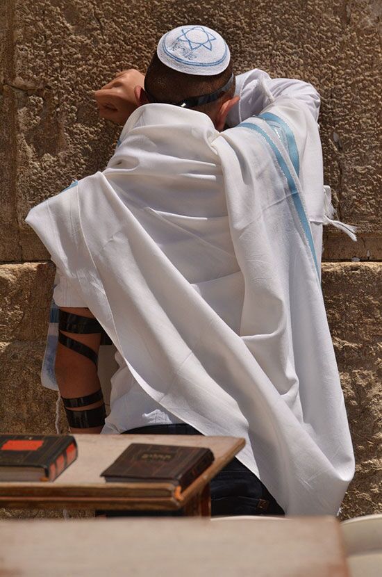 Jew praying at wailing wall A Jew praying on the wailing wall at Jerusalem as Sabbath begins