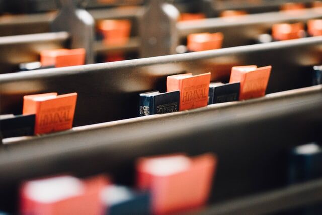 Adventist Hymnals Hymnals resting in the backs of pews at an Adventist Church