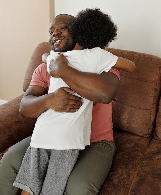 Father Hugging Son A father hugging his son just as the father of the prodigal son welcomed home his son