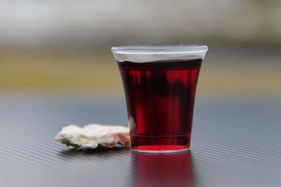 Communion Emblems A cracker and grape juice for a Communion service