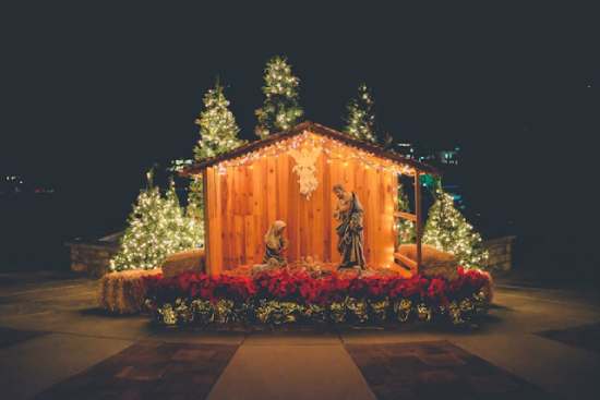 Nativity scene Christmas Jesus birth A nativity, a popular Christmas display, depicts Mary and Joseph in a stable, looking down at Baby Jesus.