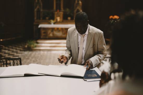 Man in a Suit Signing Many Papers A man in a suit signing legal papers leads into a discussion about how to recognize when biblical law-keeping has become legalism.